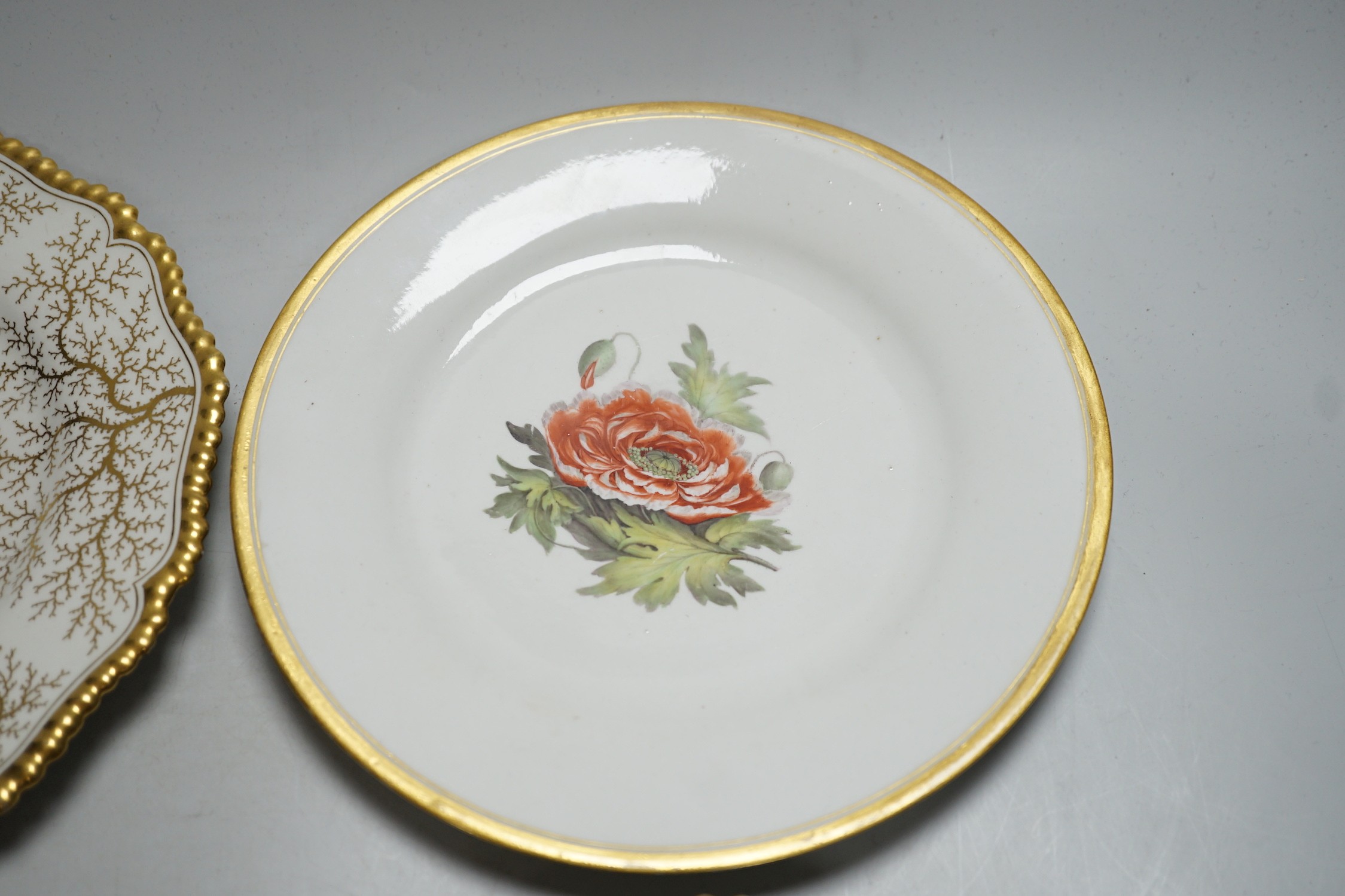 A Chamberlain's Worcester floral plate, and three Barr Flight & Barr plates, largest 22.5 cm